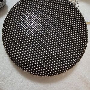 This is a spectacular black, round, blinged out rhinestone purse with chain.